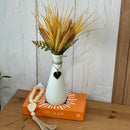 ARRANJO GARRAFINHA COM BUQUÊ DE TRIGO SILICONADO E CORAÇÃO DE FERRO 38AX20L/CM