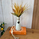 ARRANJO GARRAFINHA COM BUQUÊ DE TRIGO SILICONADO E CORAÇÃO DE FERRO 38AX20L/CM